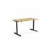 This picture features a spacious, curved bamboo top desk with a sleek black frame. The desk is equipped with height adjustable and sit stand capabilities. It measures 1400 x 700mm and is perfect for any office setting.