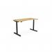 The image shows a round office desk with a rectangular bamboo top. The desk has a black frame and can be adjusted to different heights. It also has a sit stand feature for ergonomic comfort. The size is 1400 x 700mm.