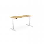The photo shows a modern and versatile office space, featuring a round height-adjustable desk with a curved bamboo top and a sleek white frame. The desk measures 1600 x 700mm and is perfect for a standing or sitting work position. The design exudes functionality and elegance.