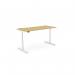 A sleek and modern office setup featuring adjustable and versatile desks. The roundE height adjustable desk has a rectangular bamboo top and a white frame, with dimensions of 1600 x 700mm. Perfect for promoting a healthier and more ergonomic work environment.