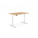 The photograph captures a modern and functional office setup with round sit stand and height adjustable desks. The desks feature a double purpose scallop and measure 1200 x 800mm in a beech and white frame. The clean lines and sleek design add a contemporary touch to the space.