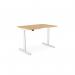 The photograph captures a modern and functional office setup with round sit stand and height adjustable desks. The desks feature a double purpose scallop and measure 1200 x 800mm in a beech and white frame. The clean lines and sleek design add a contemporary touch to the space.