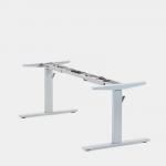 The photograph depicts a modern office space with various sit stand and height adjustable desks. The desks have round electric adjust frames and come with a up-down handset. They have a silver finish and the height can be adjusted from 650-1150mm.