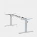 The photograph depicts a modern office space with various sit stand and height adjustable desks. The desks have round electric adjust frames and come with a up-down handset. They have a silver finish and the height can be adjusted from 650-1150mm.