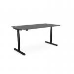 The picture shows a spacious work desk with a round shape and a sleek graphite black frame. The desk features an adjustable height mechanism and a built-in aluminum portal for easy cable management. Its surface is 1600 x 800mm, providing ample space for work. Perfect for a modern and ergonomic office setup.