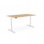The photograph shows a modern office setting with Edit Offices Sit Stand and Height Adjustable Desks. The round height adjust desk has an alu portal and measures 1800 x 800mm. The desk features a beech top and white frame, providing a sleek and professional look.