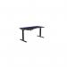 This photo shows a sleek and modern office with a variety of sit stand and height adjustable desks. The desks have grey legs and blue tops, with one desk specifically designed for left-handed use. The overall look is clean and professional, perfect for any office setting.