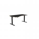 The image features a sleek, modern office set-up with a unique curvy height adjustable desk in black. The desk also features improved ergonomics with a sit-stand option and adjustable height. The black legs add a touch of sophistication to the office environment. The desktop size is 1600 x 800 and it is specifically designed for left-handed individuals. The top is also black, completing the overall stylish look.