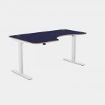 The photo showcases a modern work setting with sleek white legs and a vibrant blue top. The office features sit stand and height adjustable desks, allowing for customizable comfort and productivity. The curve design adds a touch of style to the 1600 x 800 work surface, perfect for left-handed users.