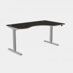 The photo features a sleek and modern office setup with a combination of sit-stand and height adjustable desks. The curvy grey legs add a unique touch, while the black top offers a professional look. The dimensions are 1600 x 800 and the desk is designed for right-handed use.