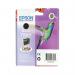 The photograph shows a box of Epson Fax Supplies & Accessories, specifically the T0801 Hummingbird Photographic Ink Cartridge in black. The packaging features the Epson logo and product information, with a vibrant image of a black hummingbird in the background. The cartridge is prominently displayed on the front, surrounded by various printer-related graphics. The overall design is sleek and professional.