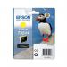 The photograph shows a set of Epson ink cartridges in bright yellow packaging. The cartridges are for UltraChrome Hi-Gloss ink and have the label Puffin on them. The design features a combination of bold and cursive fonts, with the familiar Epson logo prominently displayed.
