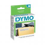 The photo shows a stack of 500 white Dymo 11352 label writer labels, measuring 54mm by 25mm, inside their original packaging. The labels are specifically designed for Dymo Label Writer printers and feature the Dymo logo on each one. The background is neutral and focuses solely on the labels, making them easy to see and identify.