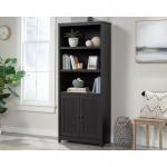 In this photograph, the Teknik Bookcases Shaker Style Bookcase with Doors Raven Oak stands tall and proud, showcasing its sleek and sophisticated design. Its rich and luxurious appearance is accentuated by the striking Raven Oak finish, while the closed doors add a touch of elegance and functionality. The classic shaker style is evident in its clean lines and timeless appeal, making it a perfect addition to any home or office space.