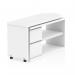 The photograph captures a sleek and modern white desk with a dynamic design. The desk features unique, flower-shaped compartments for smart storage solutions. The desk appears sophisticated and functional, perfect for any contemporary workspace.