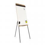 The photo shows a wooden easel with a tripod base, supporting a large flipchart pad. The pad is natural in color and measures 690x1130mm. The background features a light oak pattern.