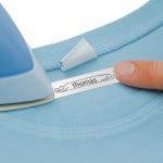 This photograph features a label tape from Newell Brands, specifically the Dymo LetraTag Label Tape Fabric Iron-On. The tape is 12mmx2m in size and is black on white. With a sleek design and reliable functionality, this label tape is perfect for a variety of labeling needs.