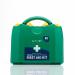 The photograph showcases a Crest Medical First Aid Blue Dot Medium BS 8599-1 (2019) First-Aid Kit in a PGB Box - M9 60087WC. The kit is neatly organized in a compact and sturdy box, with a blue dot design on the front. The label reads First-Aid Kit in bold letters. The kit contains various medical supplies and equipment, including bandages, gauze, and gloves. The box also has a handle for easy transportation.