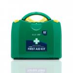 In the photo, the Crest Medical First Aid Blue Dot Large BS 8599-1 (2019) PGB First-Aid Kit is shown in a durable PGB Box with the label L9 60094WC. The kit contains a variety of items for first aid purposes and is easily identifiable with its blue dot.