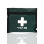 The photograph shows a compact blue emergency first aid kit for one person, designed for travel. It comes in a green Velcro pouch and includes medical supplies, such as bandages and gauze. The kit is labeled with the brand name, Crest Medical, and is easily identifiable by the blue dot on the packaging.