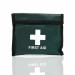 The photograph shows a compact blue emergency first aid kit for one person, designed for travel. It comes in a green Velcro pouch and includes medical supplies, such as bandages and gauze. The kit is labeled with the brand name, Crest Medical, and is easily identifiable by the blue dot on the packaging.