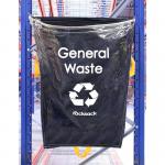 The photo shows a clear 160 litre capacity reusable general waste sack from Beaverswood Supply Ltd, known as a Racksack. The hard-wearing design is ideal for any waste disposal needs, with the companys logo prominently displayed on the front.