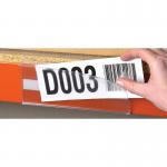 The image shows the Beaverswood Supply Ltd warehouse, with clear, magnetic ticket holders attached to shelving and racking. Each holder measures H25mmxW100mm and comes with a white card insert. This pack contains 100 holders.