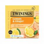 A refreshing cup of Twinings Fruit And Herbal Tea Twinings Lemon & Ginger is captured in this photo, featuring 80 loose bags of the flavorful blend. The vibrant colors of the lemon and ginger pieces pop against the black background, making for an enticing visual treat.
