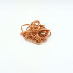 The picture shows a pack of ValueX Rubber Bands, containing a total of 454g. The bands are size No 63, measuring 6x76mm, and are made of natural rubber. The packaging is white with the brands name and product details printed in black. The bands are neatly stacked inside the packaging, appearing stretchy and pliable.