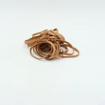 The image shows a clear plastic bag filled with long, thin rubber bands in a natural color. The bands are neatly stacked and have the ValueX logo printed on them. The bag also includes the weight of the rubber bands and their size, as well as the product name and code.