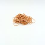 The photo shows a pack of ValueX Rubber Bands, each measuring 3x102mm, weighing 454g, and made of natural rubber. The bands are neatly stacked and wrapped in clear plastic, with the product name and logo printed in bold letters. A white background highlights the simple yet functional design of the packaging.