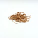 The image shows a pack of ValueX rubber bands in assorted sizes, weighing 454g. The bands are made of natural rubber and are colorless. The packaging features the product name and information.