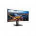 The image showcases a sleek, modern Philips monitor with a curved ultra-wide display. The Quad HD resolution of 3440 x 1440 pixels provides stunning visuals, while the 100Hz refresh rate ensures smooth and fluid movement. The monitor features HDMI, DisplayPort, and USB C ports for versatile connectivity options. LED backlighting provides bright and vibrant colors.