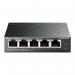 In the photo, there are multiple TP-Link routers and switches, including the 5 Port Gigabit Easy Smart PoE Switch with 4 Port PoE+. The devices are neatly arranged on a flat surface, with the switch placed in the center. The sleek black design and compact size of the devices are evident in the photo.