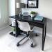 The photo shows a sleek and durable Cleartex Chair Mat, made of Floortex Polycarbonate material, measuring 1500x1200x2.3mm. It features a smooth surface and translucent appearance, with the brand name and product details etched on the corner.