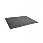 The photograph features a large black and white Doortex entrance mat with the dimensions of 1200x1800mm. The words Dust Control Door Mat can be seen printed in the center. The mat appears to be durable and high quality, with a textured surface perfect for wiping off shoes.