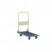 The photo shows GPC Platform Trucks GPC Folding Lightweight Trolley in bright yellow color, with four wheels and a long, flat base for transporting bulky items. The trolleys handle is folded down and the truck is compactly folded for storage.