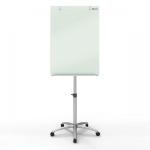 The picture shows a tall, black flipchart easel with a sleek, diamond-shaped glass board. It is mounted on four wheels, making it easily movable. A magnetic surface allows for easy attachment of notes and other materials. The brand name ACCO Brands is printed on the top of the easel. A stack of paper pads can be seen on the tray at the bottom of the easel.