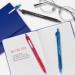 The photograph captures a collection of sleek, retractable pens in vibrant blue hues. These Ballpoint Pens from Newell Brands feature a medium tip for smooth writing and are labeled with the iconic Paper Mate logo. With a convenient box of 12, this set is perfect for any office or home workspace.