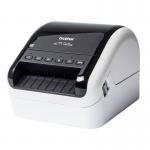 This photo shows a Brother QL-1110NWBC desktop label printer from Brother Label Makers. It features a sleek design and a wide printing area, perfect for creating professional labels and tags. The compact size makes it ideal for any office or home setup. The printer is connected to a computer via a USB cable, making it easy to use and operate. The label maker is shown in action, printing a label with crisp and clear text. The printer has a white and black color scheme and a user-friendly control panel for easy navigation. Overall, this photo captures the simplicity and efficiency of the Brother QL-1110NWBC label printer.