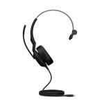 In the photo, a person is wearing the Jabra Evolve2 50 USB-C MS Teams Mono Headset. It has a sleek black design with comfortable ear cushions and a flexible microphone boom. The USB-C connector is visible and it is compatible with MS Teams. The person appears to be using it for work or communication purposes.