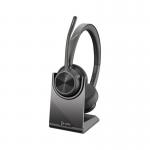 The picture captures a sleek and modern design, featuring the HP Poly Voyager 4320 UC USB-A Wireless Stereo Headset and Stand 34280J. The wireless headsets are neatly placed on the stand, conveying convenience and organization. The compact size and black color exude professionalism and style. Perfect for a clutter-free workspace.