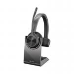 The image shows the sleek HP Poly Voyager 4310 UC USB-C Wireless Mono Headset and Stand. The headset features a comfortable and adjustable headband and a single ear cup. The stand is compact and made of durable materials. The overall design exudes professionalism and modernity.