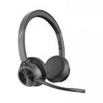 The image shows an HP Poly Voyager 4320-M UC USB-C wireless stereo headset and stand. The sleek and modern design features a black and silver finish, with comfortable padded ear cups and a flexible microphone. The USB-C connection allows for easy wireless connectivity.