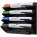 The photograph shows a sleek, black marker holder designed specifically for use with Edding drywipe accessories. The holder is designed to easily clip onto a Legamaster whiteboard and securely hold multiple markers at once. The compact design provides convenience and organization for any workspace.