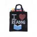 This black canvas tote bag measures 380x420mm and features an image of school stationery items such as pencils, scissors, and rulers printed in white. The bag has sturdy handles and a spacious interior, making it perfect for carrying all your school supplies.