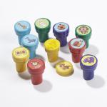 A vibrant photograph showcases a School Stationery Classmates Animal Stamper Set. The bright set includes a variety of animal-shaped stamps, each with a unique design. The packaging shows students stamping their colorful creations and smiling with delight. Perfect for adding a fun touch to any school project.