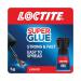 A small 5g bottle of Henkel Super Glue Loctite Super Glue Brush On is shown in the image. The bottle has a blue label with the brand name and product name prominently displayed. The brush on applicator is visible, along with the clear adhesive inside the bottle. The background is a neutral color, allowing the product to stand out. The image is clean and professional, with accurate representation of the product.