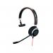 The picture shows a sleek and professional black Jabra Evolve 40 UC Mono NC headset, with a single earpiece and noise-cancelling technology. The headset is adorned with the Jabra brand logo and has a flexible microphone for clear communication.