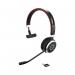 A photo of Jabra Evolve 65 SE MS Mono Wireless Headset with Link380 USB-A BT Adapter and Charging Stand shows a sleek, black headset with a single earpiece and a detachable microphone. It also features a compact charging stand and a small USB Bluetooth adapter.